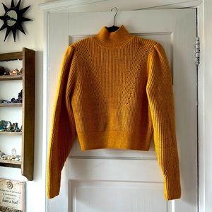 Yellow turtleneck sweater